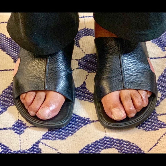 A pair of Cole Haan Leather Slippers